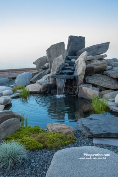Bold rock statement small pond waterfall dramatic backyard garden design