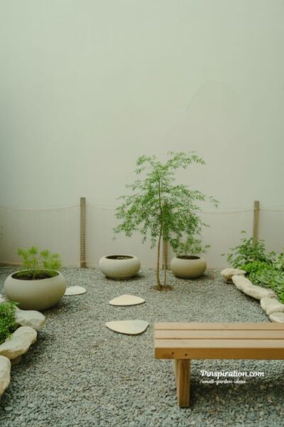 Small garden ideas with simple minimalist design that creates calm balance through open space and natural textures