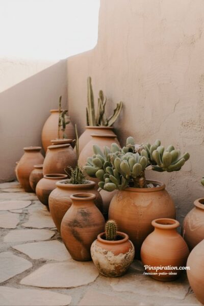 Terracotta plant Mexican patio ideas with succulents and earthy rustic courtyard styling