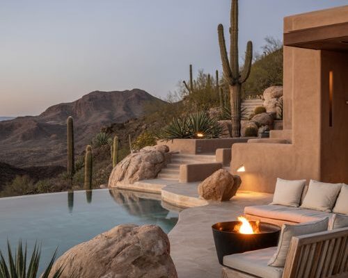 Desert pool landscaping with infinity pool cactus garden and natural stone oasis