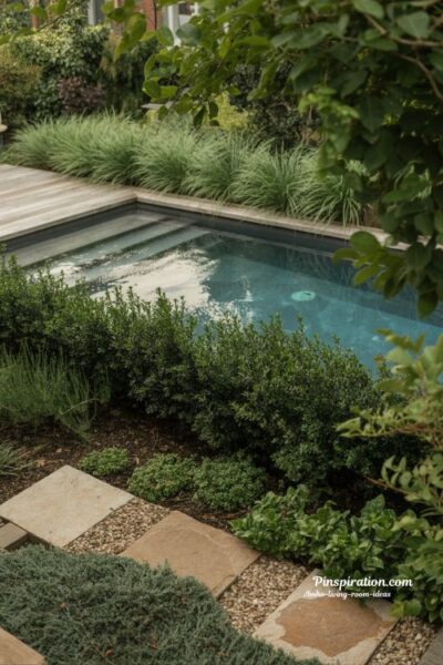 Hidden above ground pool design surrounded by lush greenery and natural garden privacy landscaping