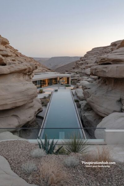 Hidden canyon desert retreat pool with valley views and glass balustrade infinity edge