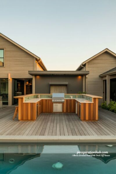 Outdoor kitchen above ground pool deck attached house L-shaped design ideas