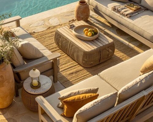 Pool side decorating ideas with warm natural stone and organic outdoor lounge styling