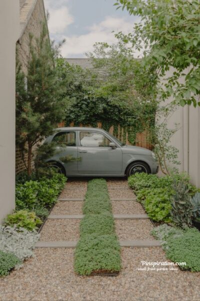 Small front garden ideas with smart parking integration using gravel wheel tracks and green edging design