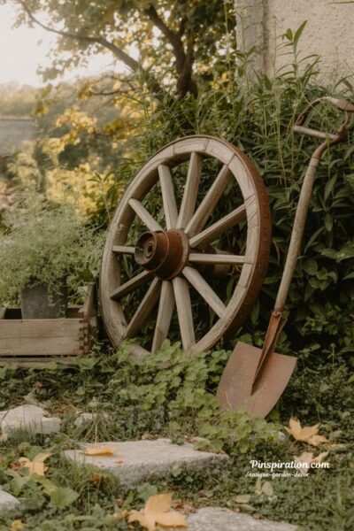 antique wagon wheel in garden covered with climbing vines rustic nostalgic outdoor decor