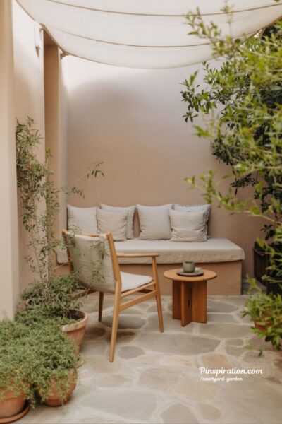 courtyard garden seating with built in bench soft cushions and shaded cozy outdoor living space
