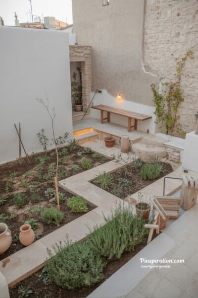courtyard garden transformation ideas with evolving greenery lighting and warm lived in outdoor space makeover