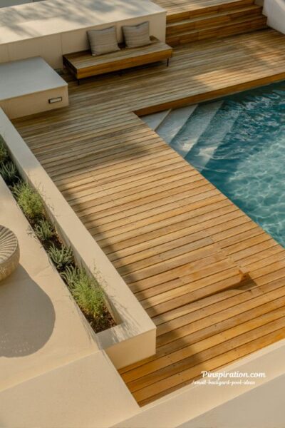 minimalist pool deck ideas for small backyard with warm wood and clean modern outdoor design
