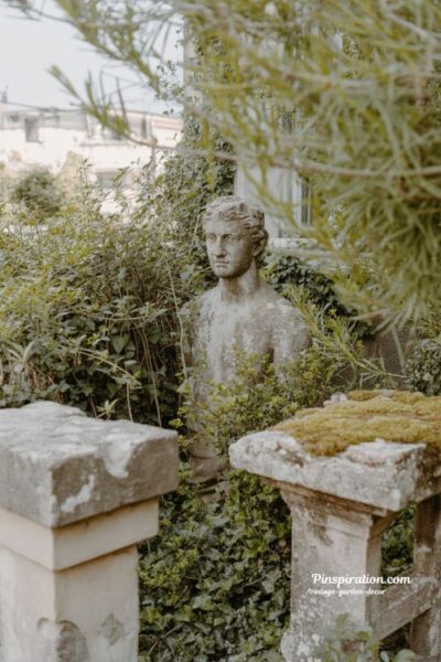 old statue garden with vintage stone sculpture and overgrown ivy mystical garden aesthetic