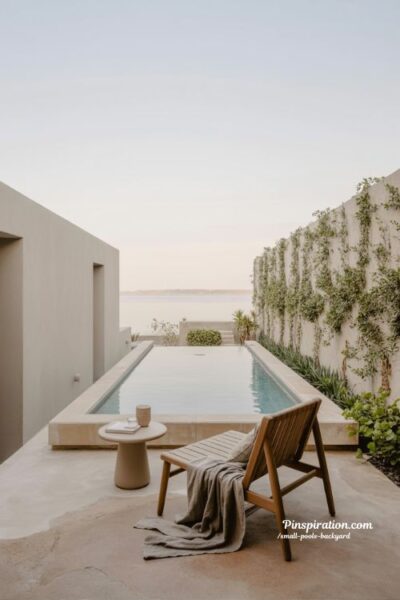 small backyard infinity edge pool design that makes compact spaces feel larger
