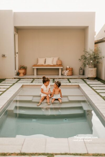 small backyard shallow family pool with wide steps and warm minimalist design
