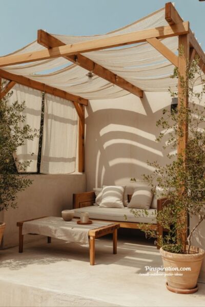 small outdoor patio ideas pergola shade with soft fabric and cozy seating for comfortable outdoor space