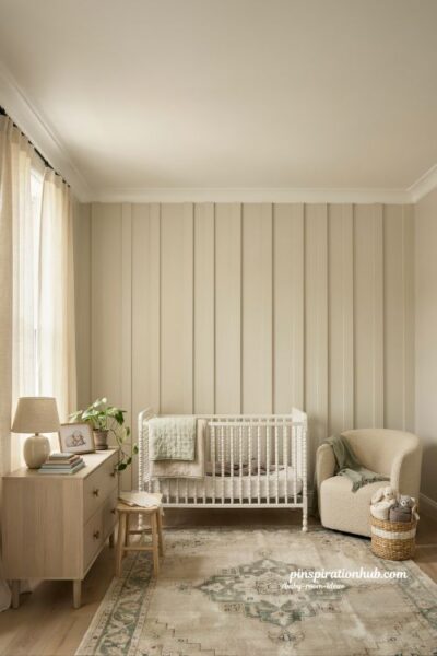 Baby room ideas with board and batten accent wall behind crib and timeless nursery decor