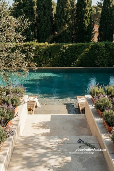 Mediterranean infinity pool with lush green backdrop and luxury garden design