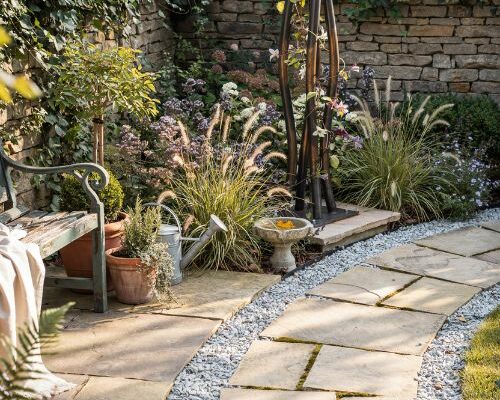 Metal garden art focal point transforming a backyard into a beautiful outdoor retreat