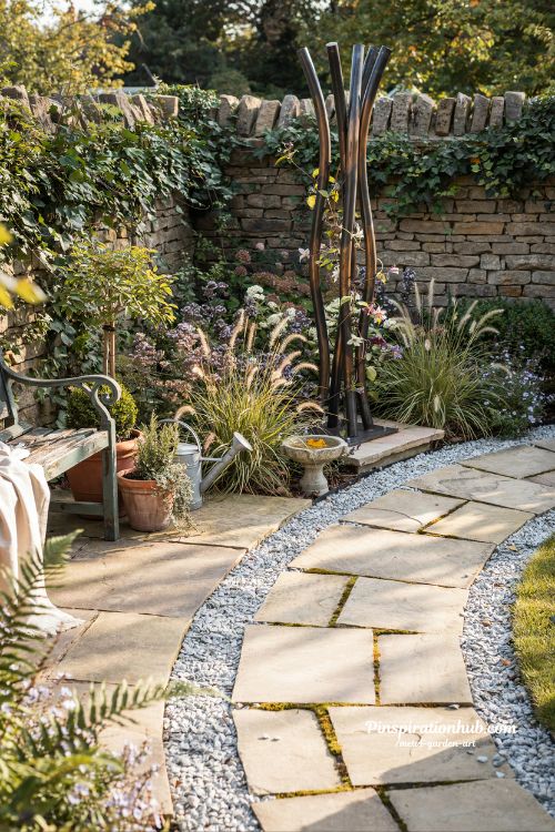 Metal garden art focal point transforming a backyard into a beautiful outdoor retreat