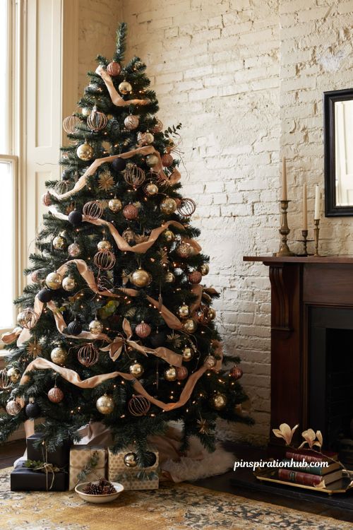 A sophisticated black Christmas tree with warm gold and copper ornaments in a cozy historic brownstone living room.
