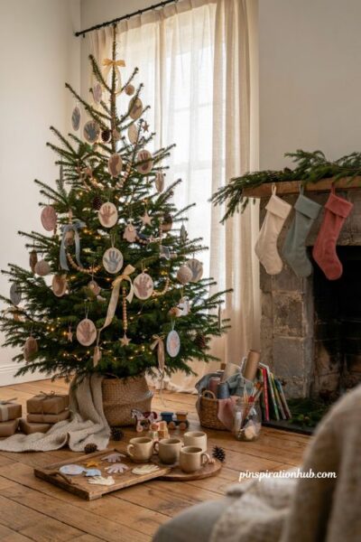 Christmas tree ideas for kids with handprint footprint keepsake ornaments and cozy family holiday decor