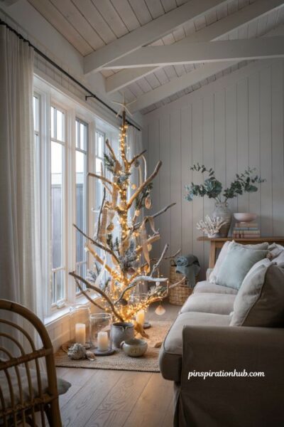 Coastal christmas living room with driftwood christmas tree and relaxed beach house holiday decor