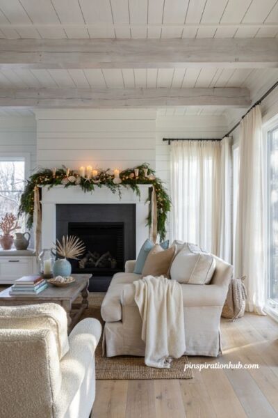 Coastal christmas mantel with shell studded garland and elegant beach house holiday decor
