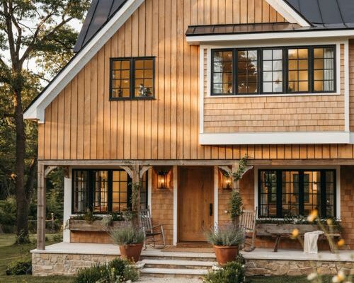 Farmhouse exterior with warm cedar wood siding and timeless cottage charm