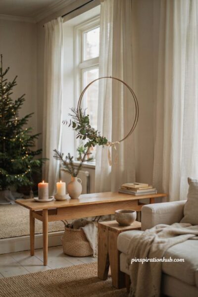 Minimalist christmas decor ideas with a simple hoop wreath and natural greenery