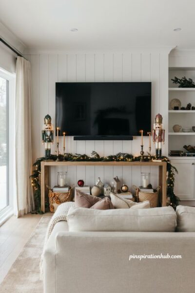 Symmetrical christmas tv console decor with nutcrackers and elegant holiday living room styling
