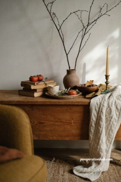 Cozy fall porch ideas using rust mustard and brown decor pieces found around the home