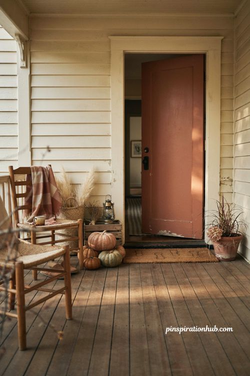 Cozy fall porch ideas with pumpkins woven baskets vintage lanterns and warm rustic textures