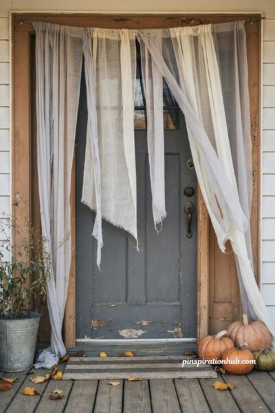 Diy tattered cheesecloth halloween door decoration with aged fabric