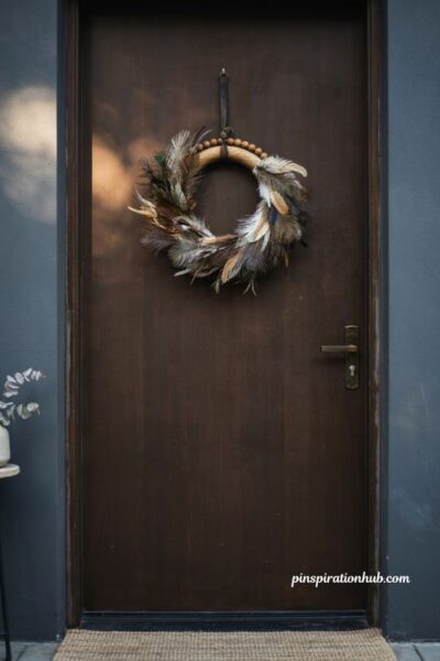 Feather and walnut wreath for front door with brown feathers leather strap and beaded hoop