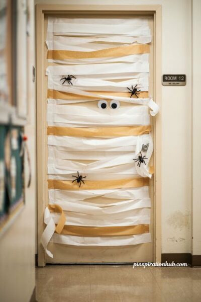 Minimalist mummy door with googly eyes for Halloween classroom decor