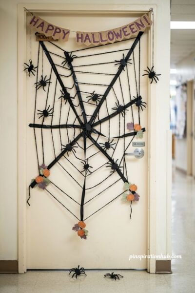 Paper spider web door with diy Halloween classroom decorations