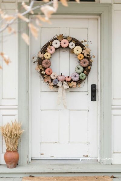 Pastel ombre pumpkin wreath for front door with blush lavender peach and faded fall leaves