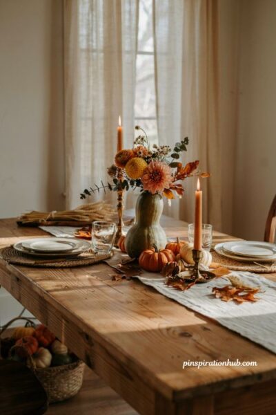 Unique gourd flower centerpiece idea with fall blooms for rustic autumn table decor