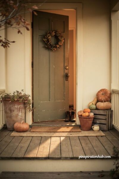 charming fall porch ideas for a small entryway with pumpkins wreath layered rugs and rustic planters