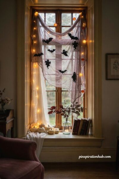 fairy light Halloween window curtains with glowing gauze, bat silhouettes, ghost lights and pumpkins