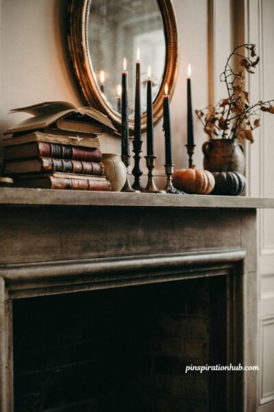 Black candle Halloween mantel decor with mismatched holders