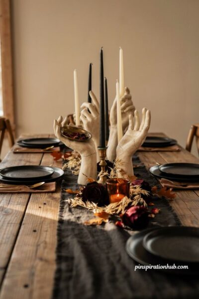 DIY plaster hand candle holders Halloween centerpiece with taper candles