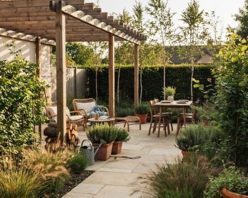 Dream backyard with cozy outdoor seating natural stone and garden zones