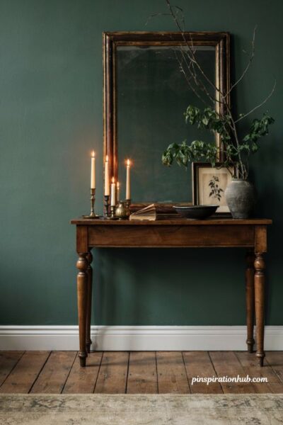 Elegant Halloween entryway with Gothic mirror and black botanical art