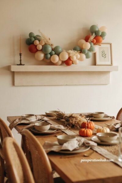 Fall balloon garland with sage green rust orange and cream harvest decor