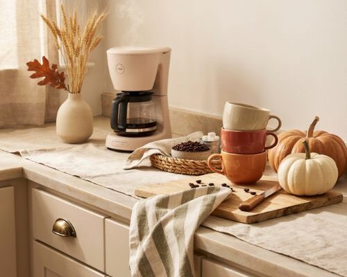 Fall coffee bar with pumpkins favorite mugs and cozy kitchen counter decor