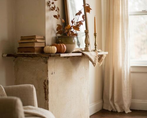 Fall fireplace mantel decorating ideas with old books vintage mirror and simple repurposed decor