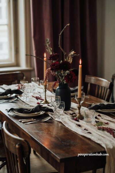 Halloween dining table decor with dark burgundy floral centerpiece