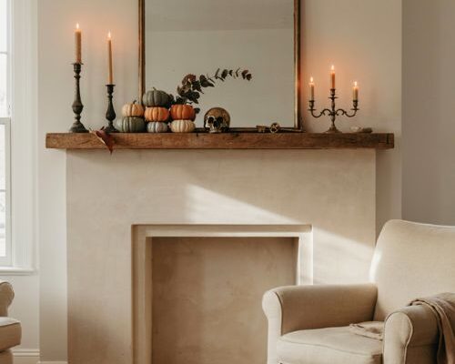 Halloween mantle ideas with pumpkins candles and cozy autumn fireplace decor