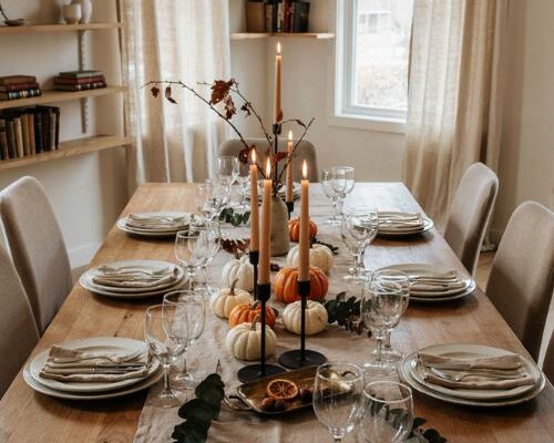 Halloween table runners with pumpkins candles and elegant autumn centerpiece