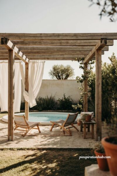Inflatable pool under pergola with outdoor curtains chairs and climbing vines