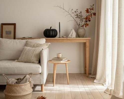 Minimalist Halloween decor with subtle black pumpkins and natural textures